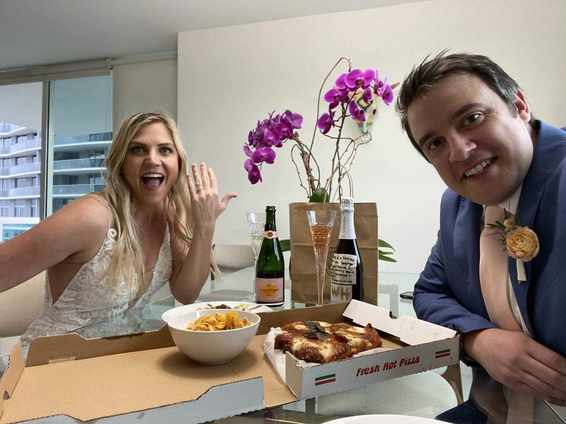 Jamie Webner shows off her wedding ring as she shares a meal from Macchialina, the restaurant where they celebrated their engagement, with her now-husband Ben Katz. The couple got married on April 4, 2020, on the balcony of their Brickell apartment amid the coronavirus pandemic.