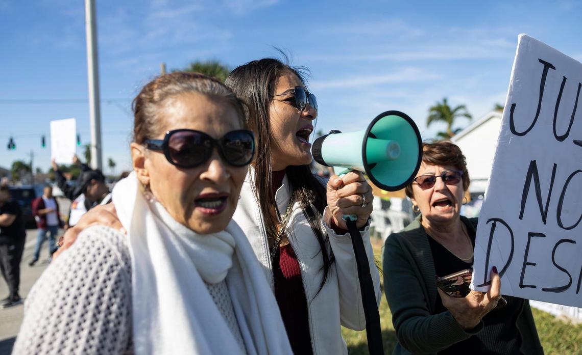 From left to right: Leonarda Soza, Indra Palma and Maria Caridad Hernandez participate in a protest near one of the entrances to the Li’l Abner Mobile Home Park on Saturday, Dec. 21, 2024, in Sweetwater, Florida.