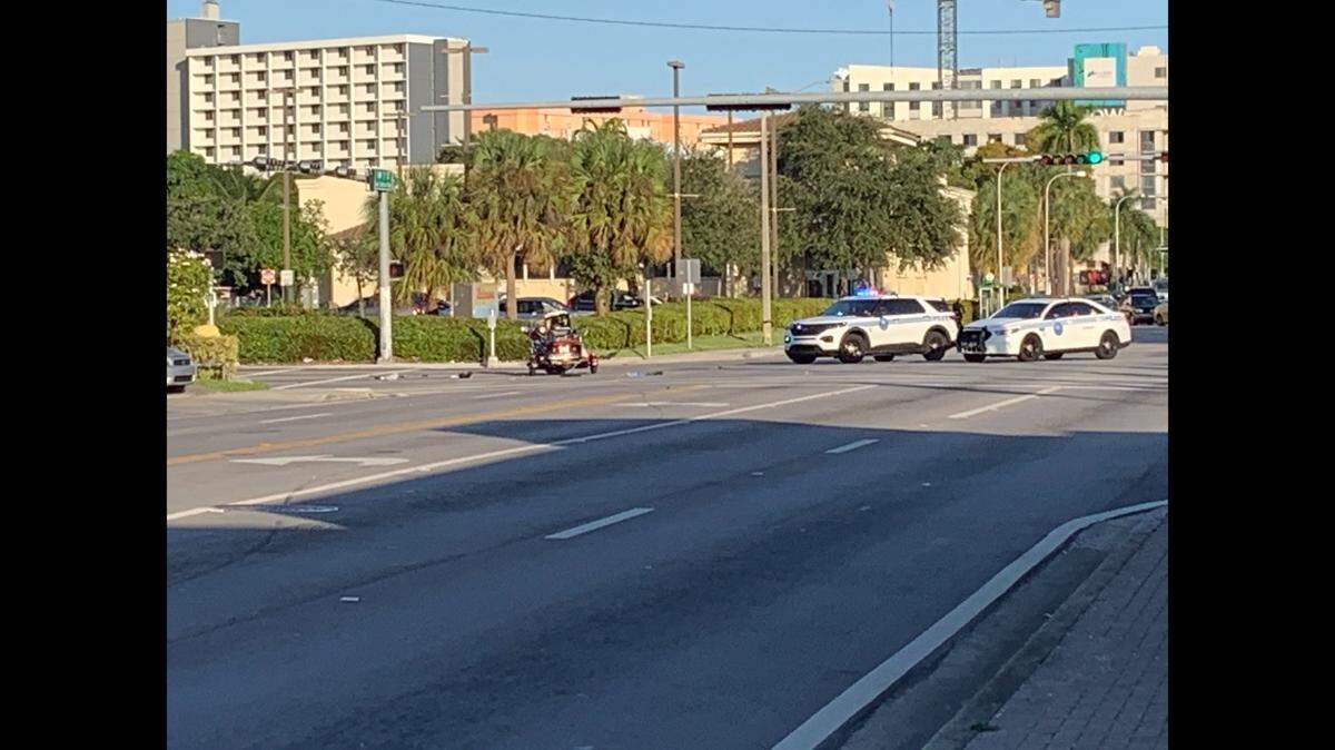The crashed motorcycle and debris at the closed intersection of Northwest 17th Avenue and Seventh Street.