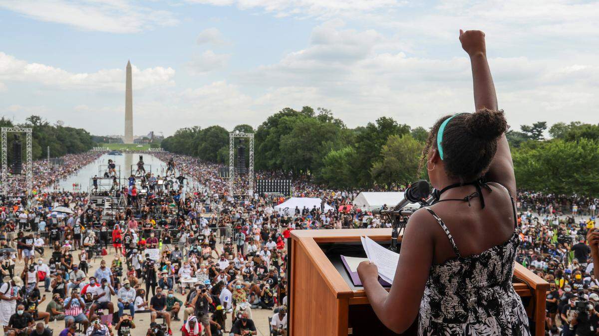 FILE - Yolanda Renee King, granddaughter of The Rev. Martin Luther King Jr., raises her fist as she speaks during the March on Washington, on the 57th anniversary of the Rev. Martin Luther King Jr.’s “I Have a Dream” speech on Aug. 28, 2020. California’s first-in-the-nation task force on reparations is at a crossroads with members divided on which Black Americans should be eligible for compensation. The task force could vote on the question of eligibility on Tuesday, March 28, 2022, after putting it off at last month’s meeting. (Jonathan Ernst/Pool Photo via AP, File)