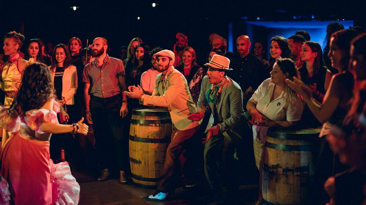 Audience members interact with the cast of “The Amparo Experience.”