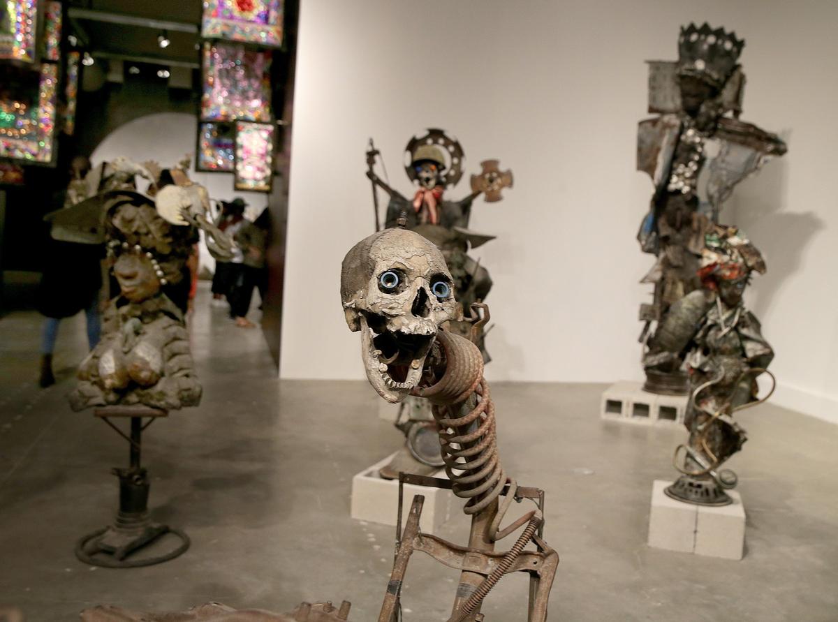 Haitian artist Andre Eugene, who lives in Port-au-Prince, created this piece at at the Moca Museum of Contemporary Art in North Miami. It’s part of the exhibit “PORTOPRENS: The Urban Artists of Port-au-Prince” which features works that illuminate the history, music, politics, religion, magic, architecture, art, and literature that intersect in the Haitian capital.