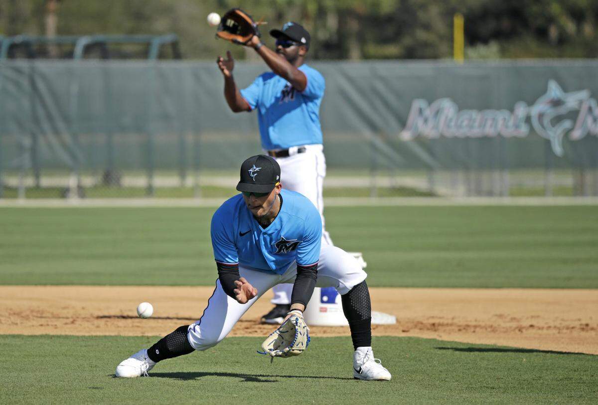 Miami Marlins infielder Jonathan Villar (2) run drills during the first full-squad spring training workout at Roger Dean Stadium on Monday, February 17, 2020 in Jupiter, FL.