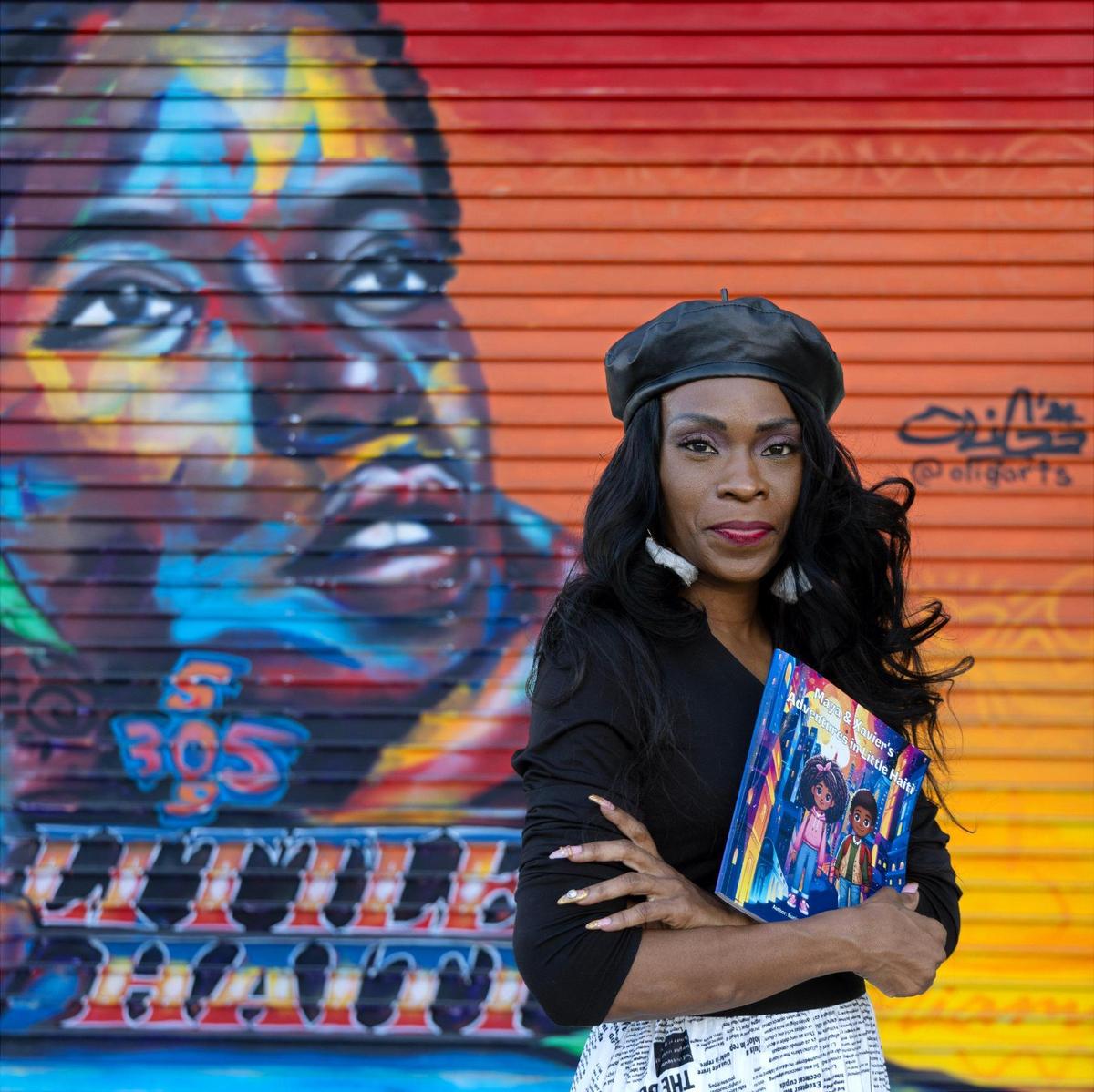 Eunice Flowers, a North Miami Beach entrepreneur and author, showcases her book that chronicles the rich Black history of Miami’s Little Haiti neighborhood.