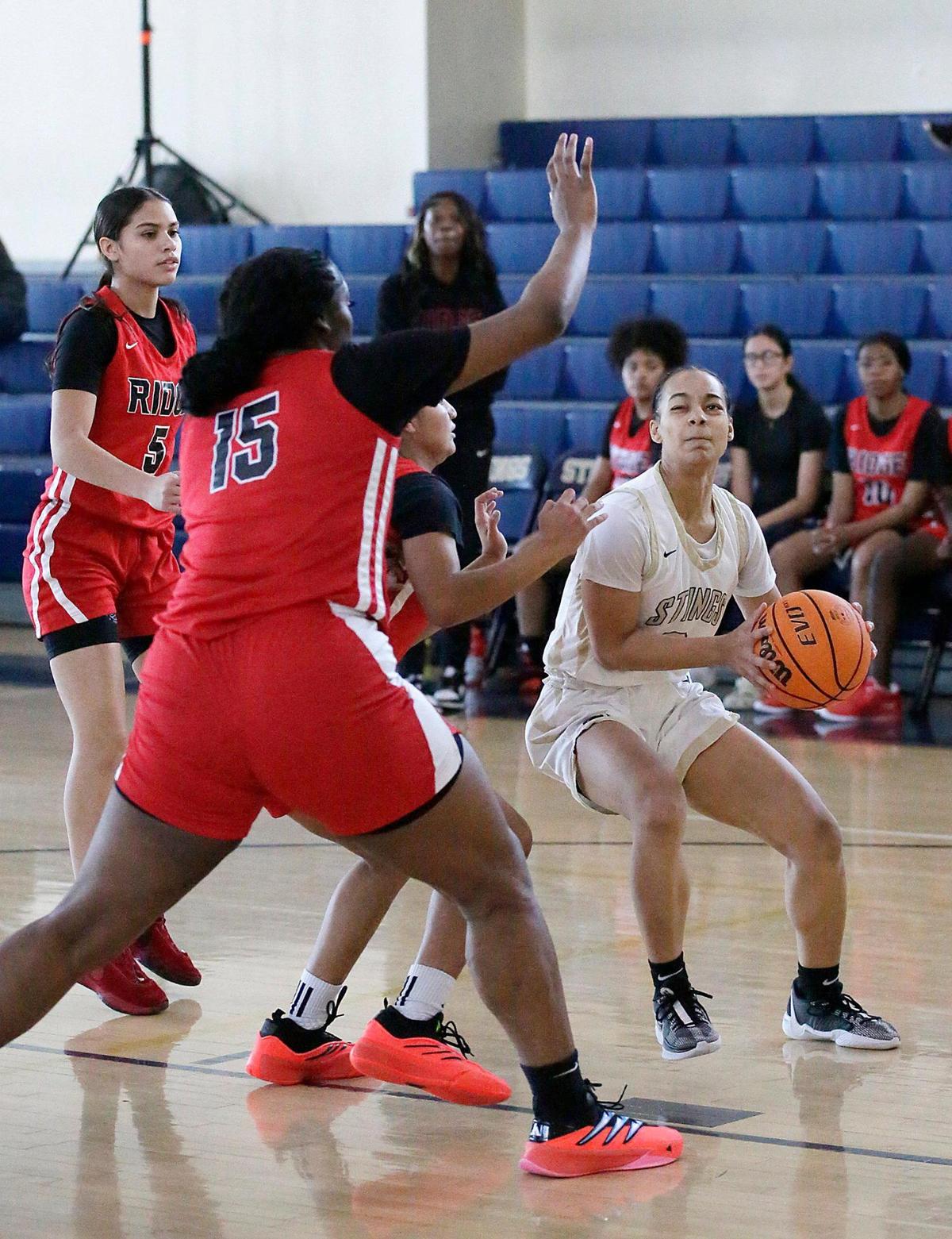 Miami High’s Sydney Wilson tries to shoot while being tightly guarded by Southridge players during the GMAC girls’ basketball final Saturday, January 25, 2025 at Miami Senior HS in Miami.