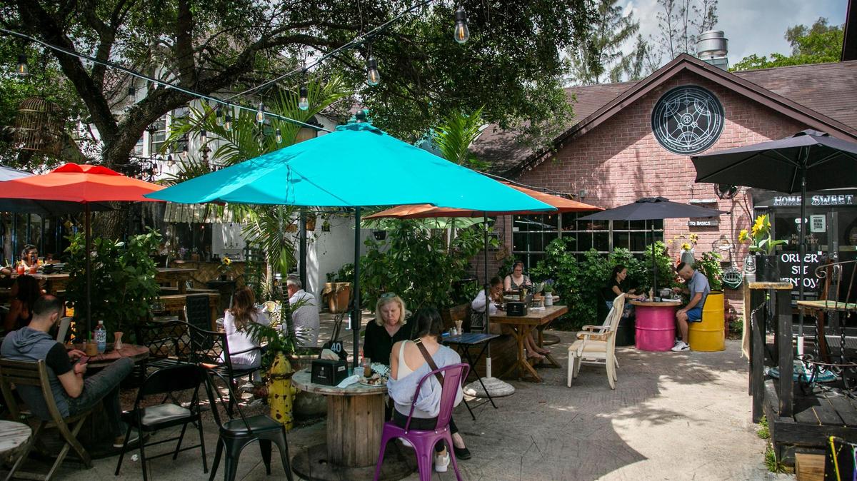 Outdoor seating area at The Alchemist in Aventura.