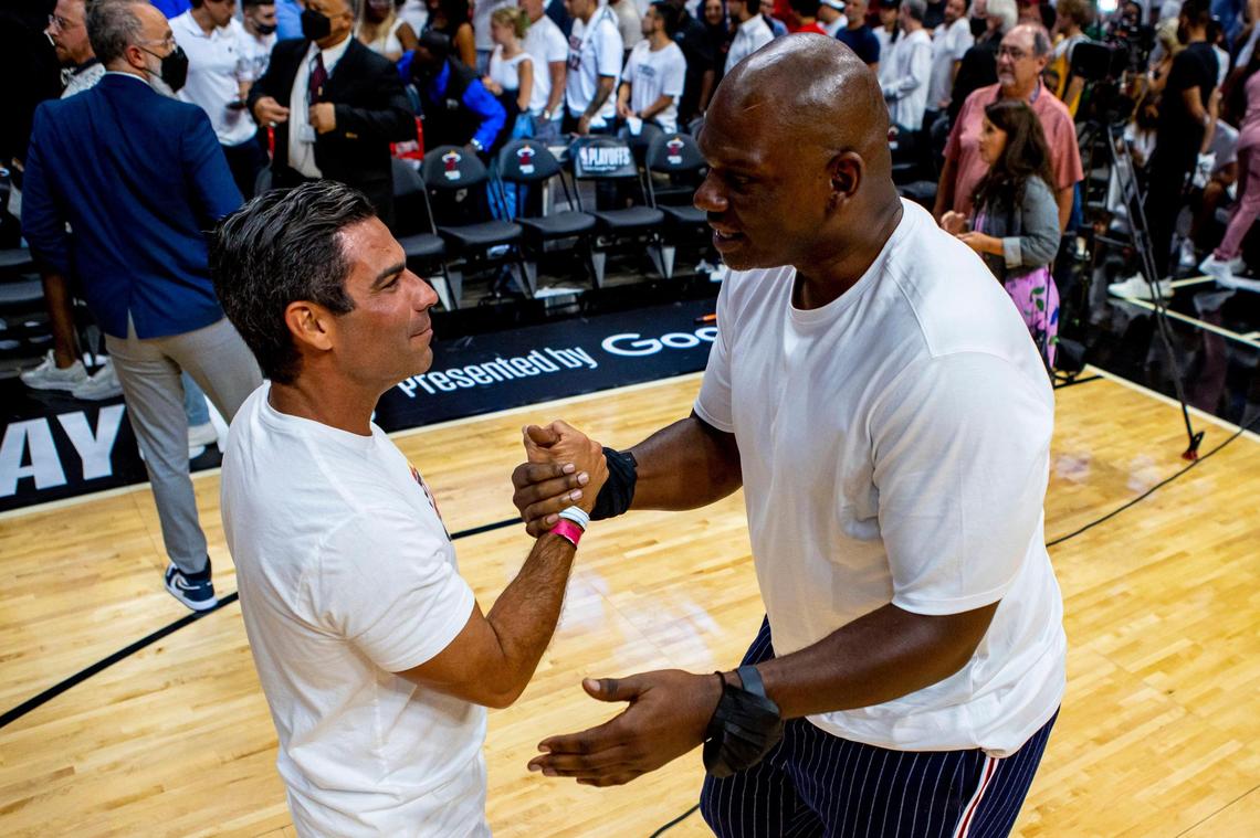Mayor of Miami Francis X. Suarez, left, and former NBA player, Jamal Mashburn, right, say hello to one another on the court after the fourth quarter of Game 1 of the NBA Eastern Conference Finals series between the Miami Heat and the Boston Celtics at FTX Arena in Miami, Florida, on Tuesday, May 17, 2022.