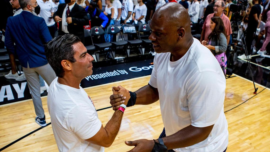 Mayor of Miami Francis X. Suarez, left, and former NBA player, Jamal Mashburn, right, say hello to one another on the court after the fourth quarter of Game 1 of the NBA Eastern Conference Finals series between the Miami Heat and the Boston Celtics at FTX Arena in Miami, Florida, on Tuesday, May 17, 2022.