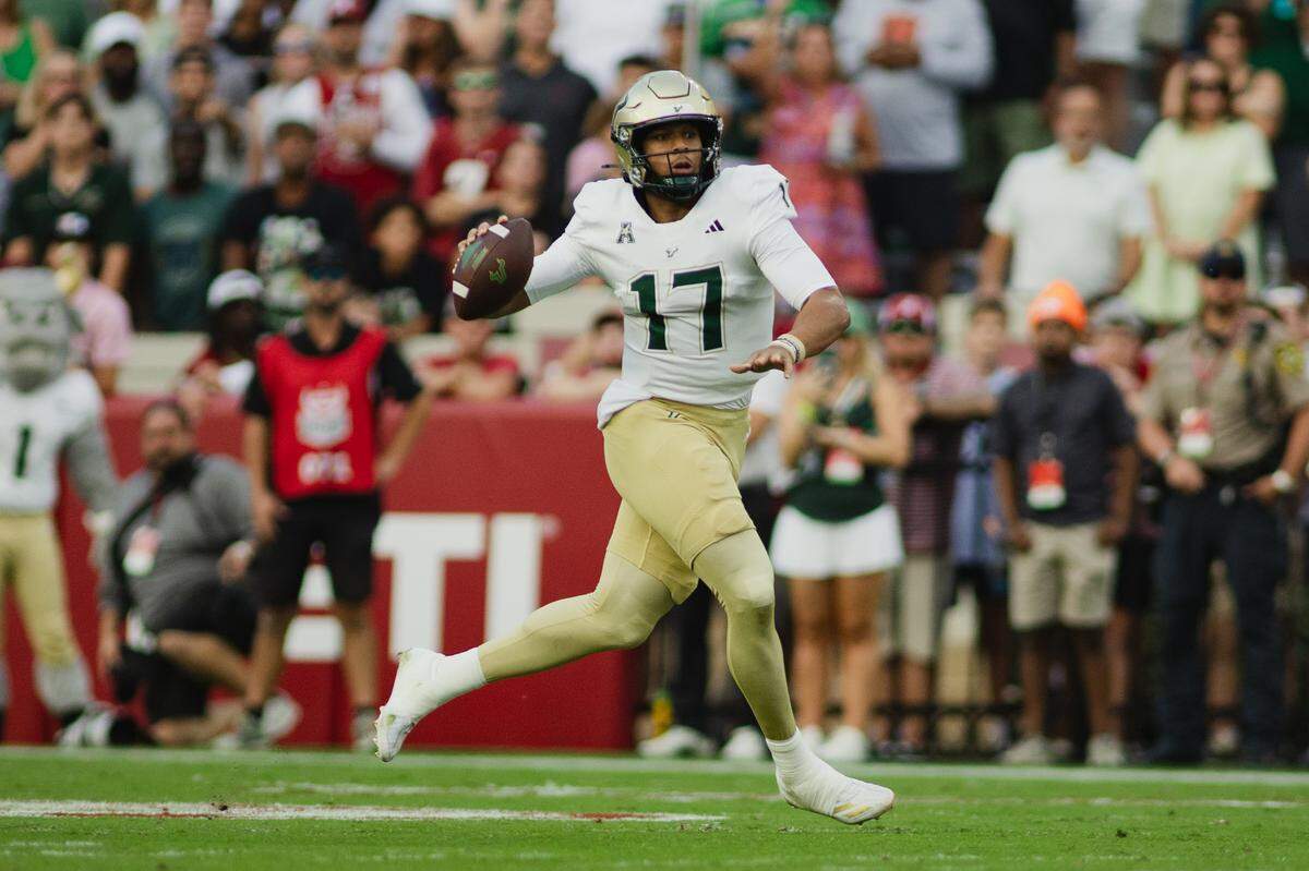Sep 7, 2024; Tuscaloosa, Alabama, USA; South Florida Bulls quarterback Byrum Brown (17) prepares to throw against the Alabama Crimson Tide during the first quarter at Bryant-Denny Stadium. Mandatory Credit: William McLelland-Imagn Images