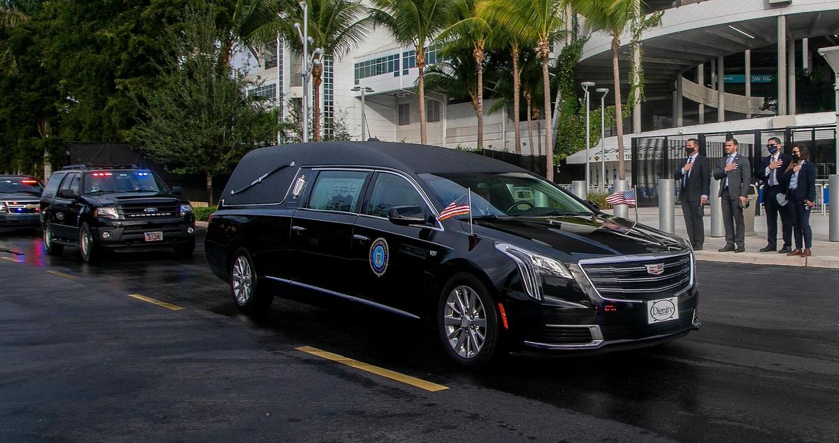 Mourners pay tribute as the law enforcement procession for slain FBI Special Agent Laura Schwartzenberger leaves Hard Rock Stadium after a memorial service to honor her on Saturday.