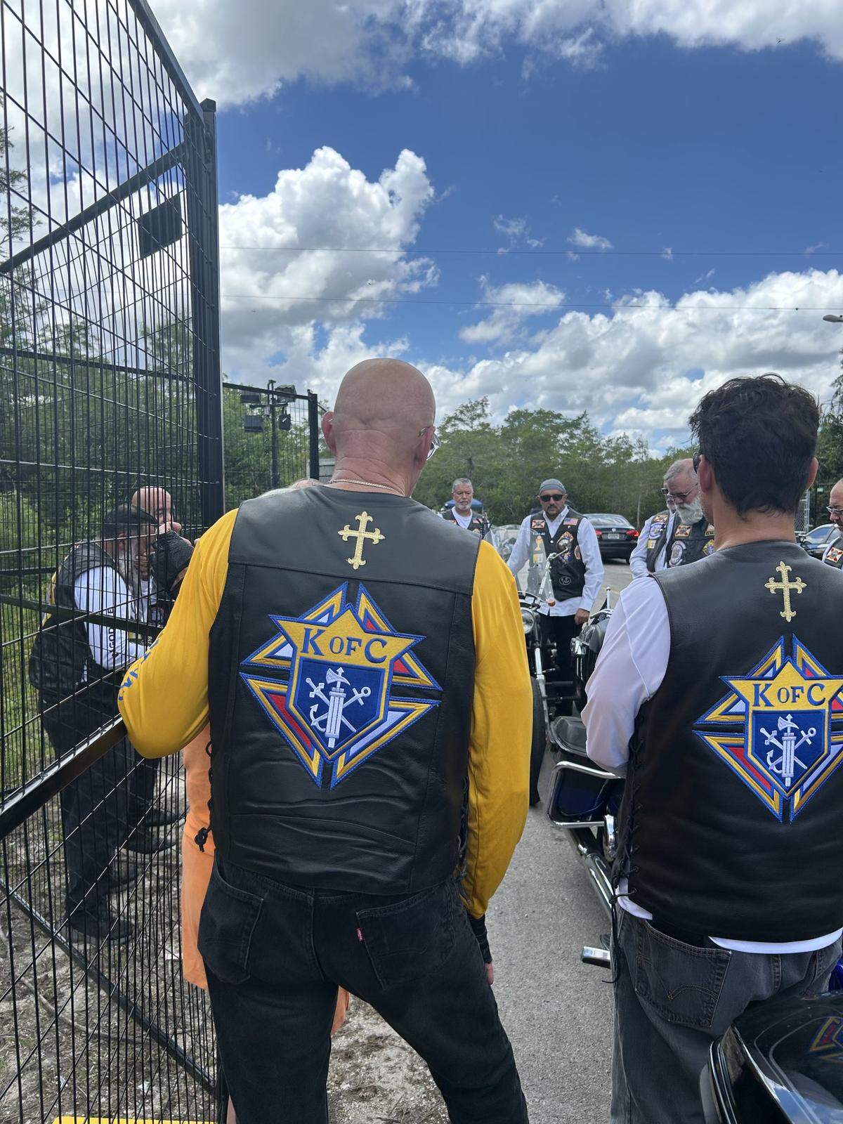Archbishop Thomas Wenski visited Florida’s new detention center in the Everglades with 25 members of the Archdiocese of Miami’s Knights on Bikes ministry to pray for the migrants being held there.