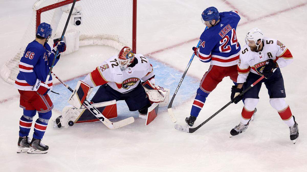 May 30, 2024; New York, New York, USA; Florida Panthers goaltender Sergei Bobrovsky (72) makes a save in front of New York Rangers defenseman Erik Gustafsson (56) and right wing Kaapo Kakko (24) during the third period of game five of the Eastern Conference Final of the 2024 Stanley Cup Playoffs at Madison Square Garden. Mandatory Credit: Brad Penner-USA TODAY Sports