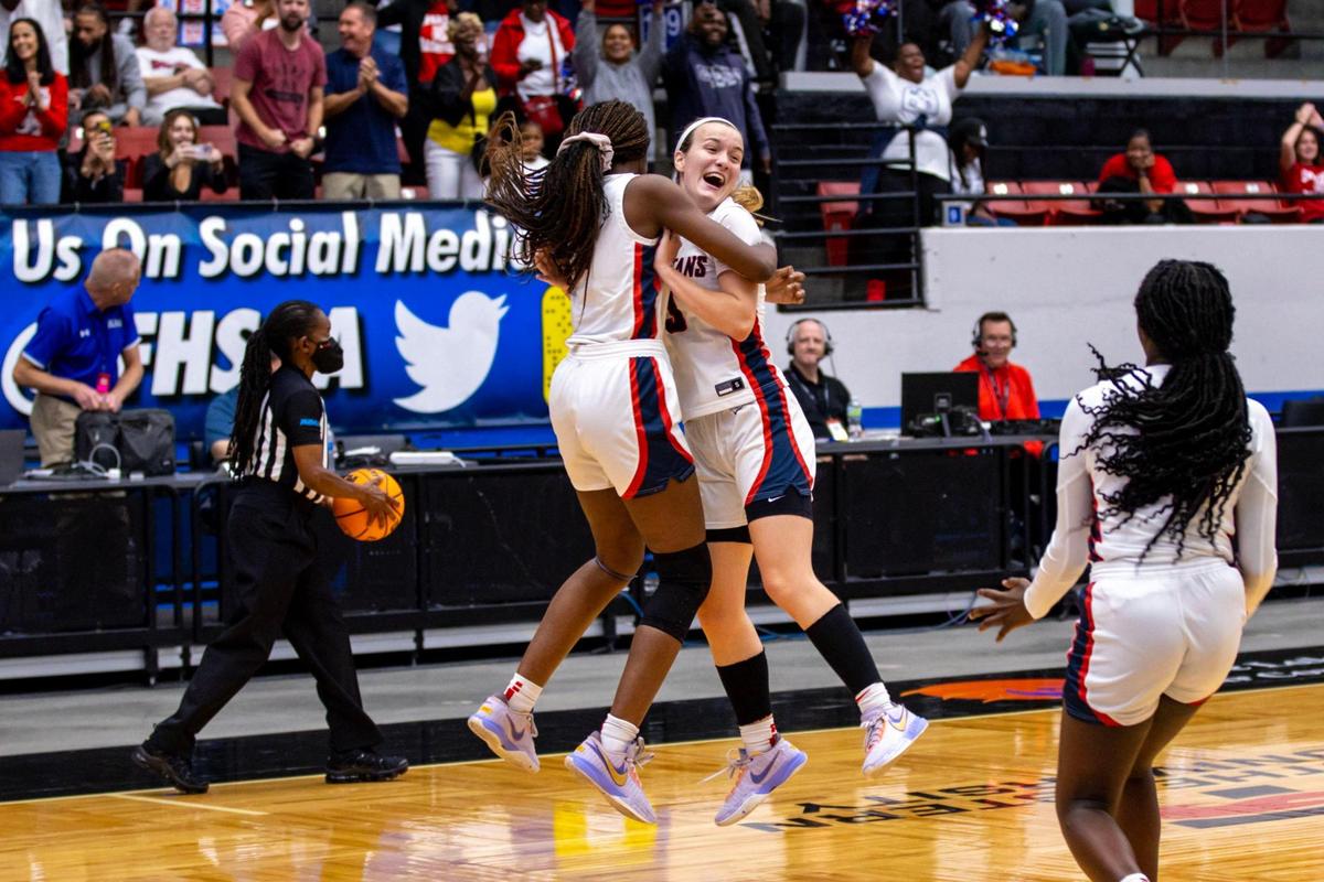 Miami Country Day guard Kristina Godfrey (3) reacts with teammate Aicha Keita (5) after defeating Cardinal Mooney 54-38 during the Class 3A state Girl’s basketball championship game at RP Funding Center in Lakeland, Florida, on Saturday, February 25, 2023.