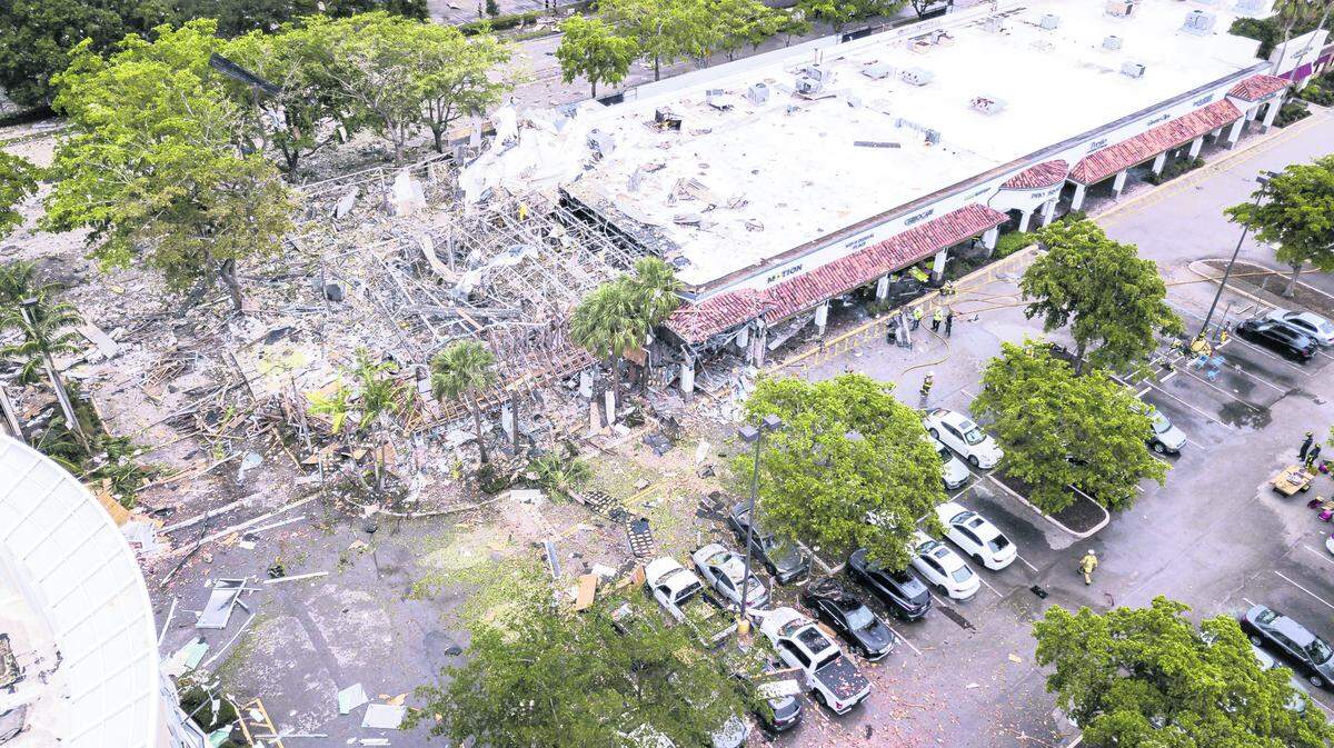 A gas explosion at PizzaFire, a pizza parlor across from the Fountains Plaza in Plantation, on Saturday, July 6, injured 23 people and caused the windows to blow out at LA Fitness.