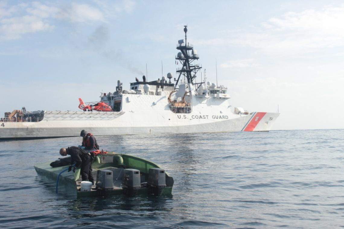 A low-profile go-fast vessel is shown next to the Coast Guard Cutter James in mid-May, 2020, in the Pacific Ocean off the coast of Central America. The James’ crew interdicted 3,100 pounds of cocaine and four suspected smugglers aboard the boat.