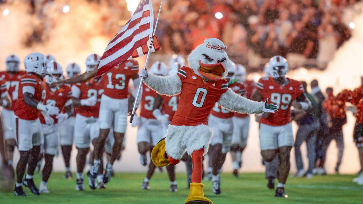 The Miami Hurricanes rush the field for their NCAA football game against the Florida Gators at Hard Rock Stadium in Miami Gardens, Florida, on Saturday, September 20, 2025.