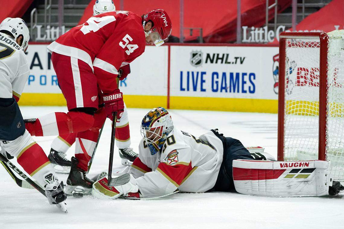 Florida Panthers goaltender Chris Driedger (60) stops a Detroit Red Wings right wing Bobby Ryan (54) shot in the second period of an NHL hockey game Sunday, Jan. 31, 2021, in Detroit. (AP Photo/Paul Sancya)