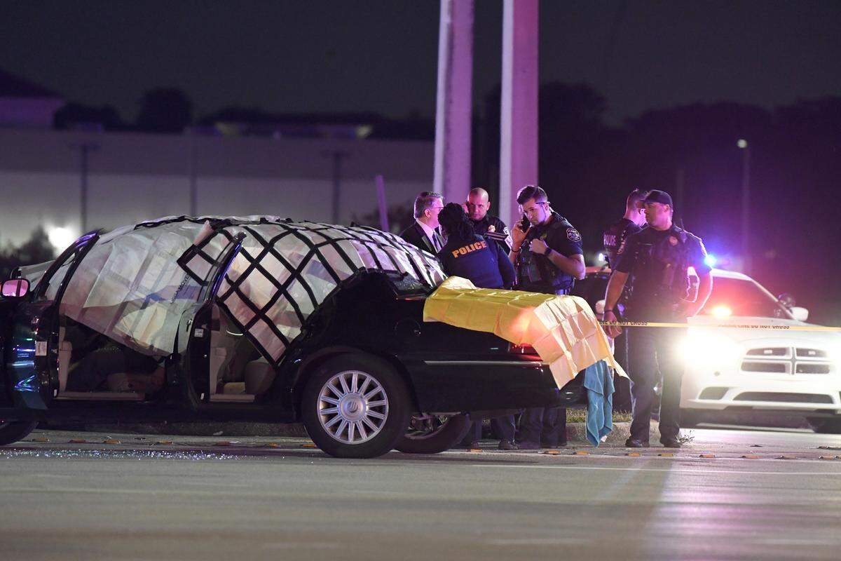 Officers from Miramar and Miami-Dade work the scene at the intersection of Miramar Parkway and Flamingo Road in December 2019. Motorist Richard Cutshaw, of Pembroke Pines, was shot and killed inside his car.