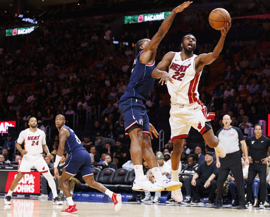 Miami Heat forward Andrew Wiggins (22) shoots the ball around Los Angeles Clippers forward Kawhi Leonard (2) during the fourth quarter of a game on Monday, Dec. 1, 2025, at Kaseya Center in Miami, Fla.