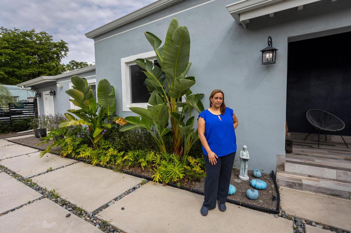 Zarahy Pacheco, alongside her home on Northwest 18th Street in Miami.