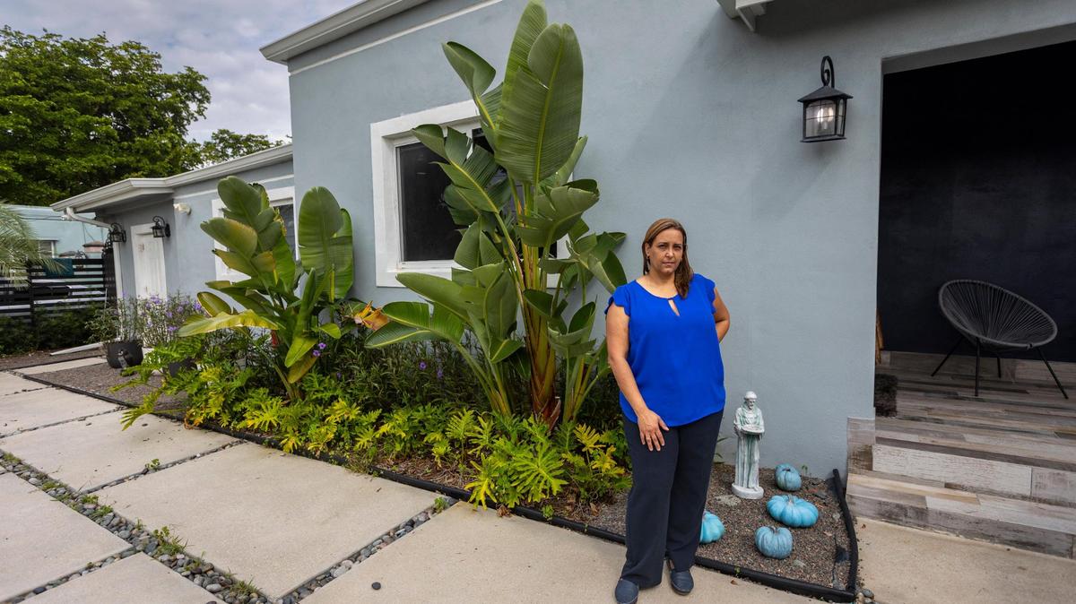 Zarahy Pacheco, in front of her house on Northwest 18th Street in Miami. She has been fighting the city for three years over code violations.