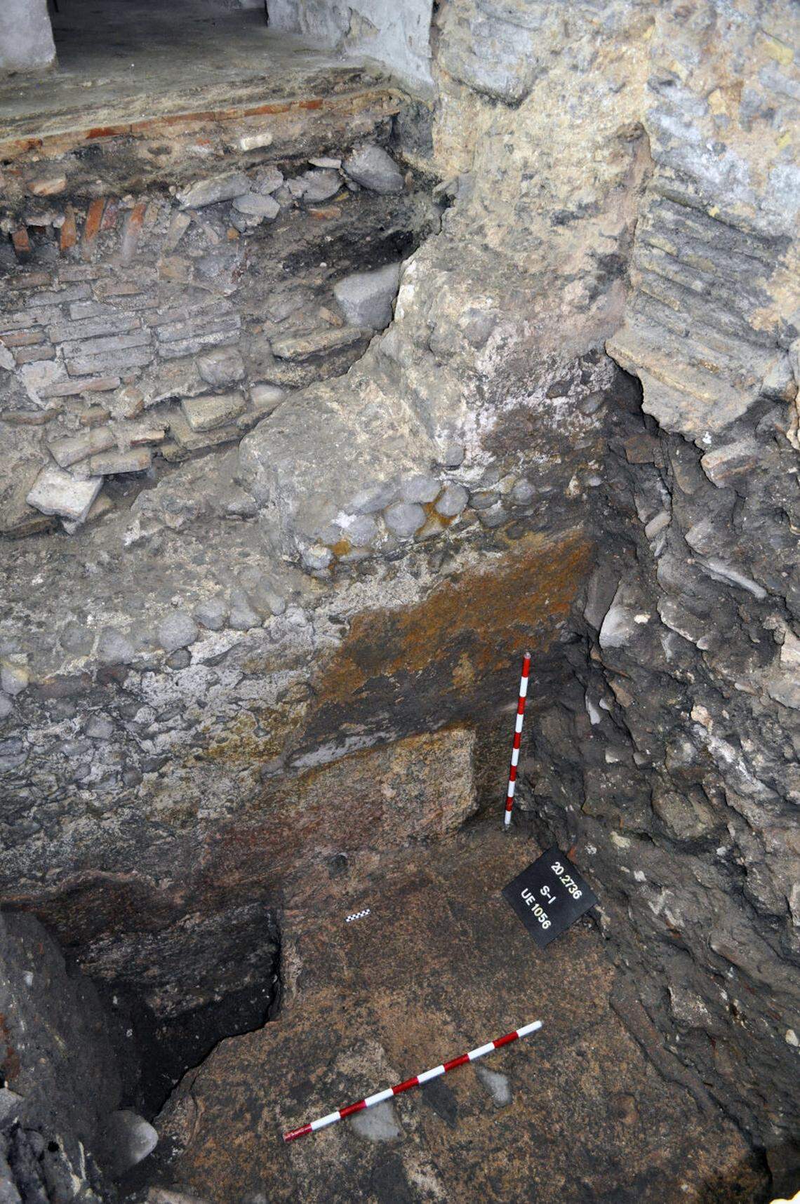 A view looking down into a Roman bath before restoration.