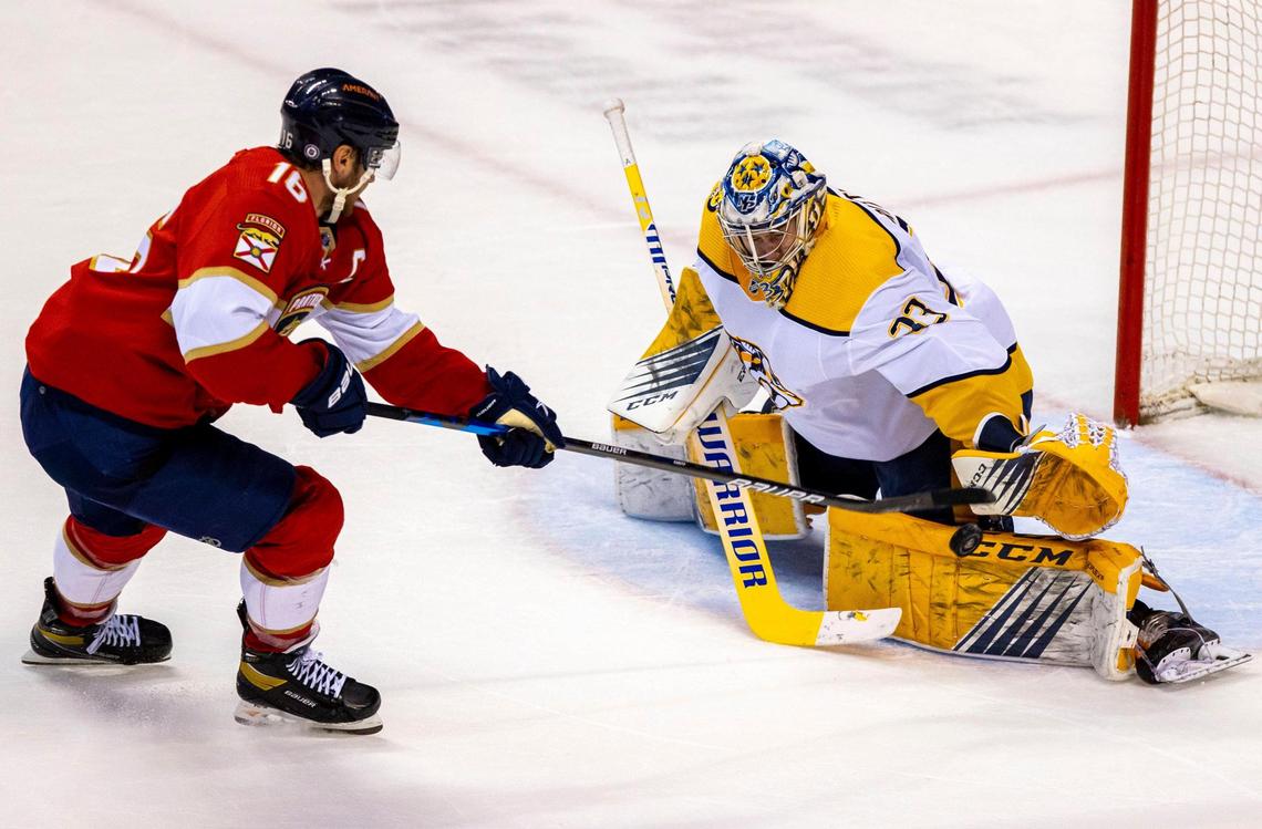 Florida Panthers center Aleksander Barkov (16) shoots on Nashville Predators goalie David Rittich (33) during the second period of an NHL game at FLA Live Arena in Sunrise, Florida, on Tuesday, February 22, 2022.