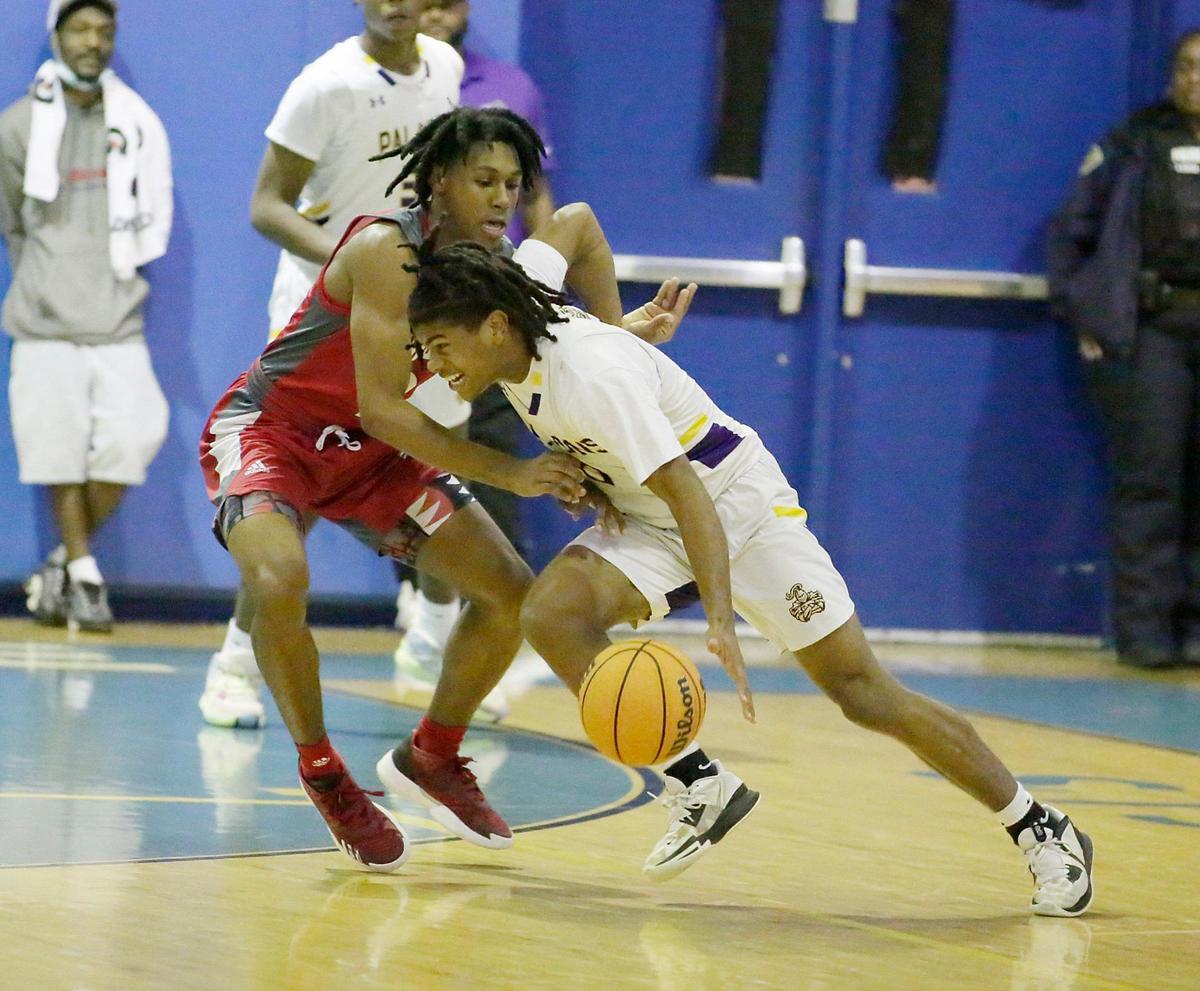 South Plantation Paladins Kaiden Francis controls the ball during the BCAA Boys Big 8 2023 Basketball championship game against Cardinal Gibbons Chiefs on Saturday, February 4, 2023 at Fort Lauderdale HS in Fort Lauderdale. Andrew Uloza / for Miami Herald