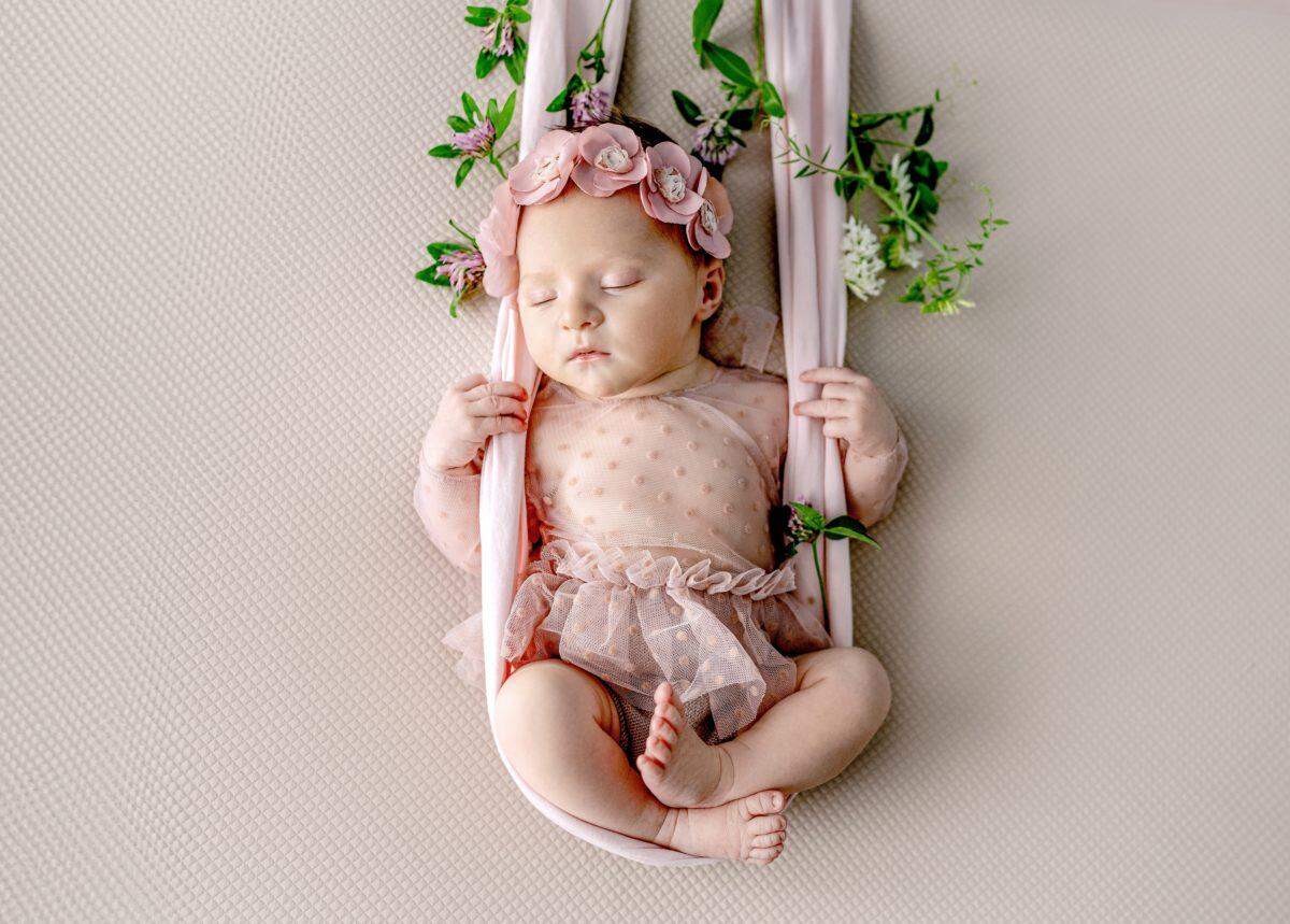 baby girl with pink roses