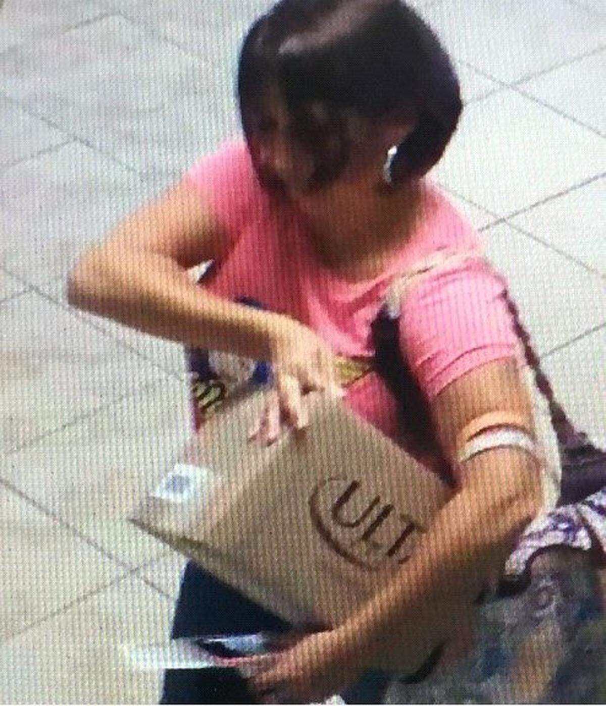 A woman is filmed on a security camera taking a package of beauty supplies from the mail room of the Summer Seas Condominium on Plantation Key on March 29, 2018.