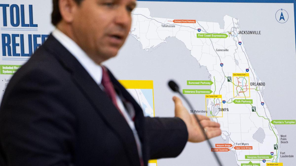 Florida Governor Ron DeSantis points to highways included in a toll relief program for people who travel over 35 times per month on toll roads during press conference on Monday, April 1, 2024, at the Greater Miami Expressway Agency in Miami.