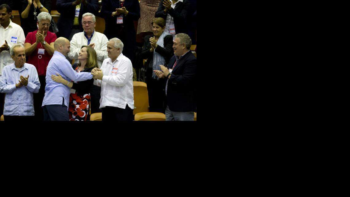 
In this Dec. 20, 2014 photo, Cuba’s head of North American affairs, Josefina Vidal, front row center, embraces Gerardo Hernandez, member of “The Cuban Five,” at the closing of the twice-annual legislative session at the National Assembly in Havana. 
