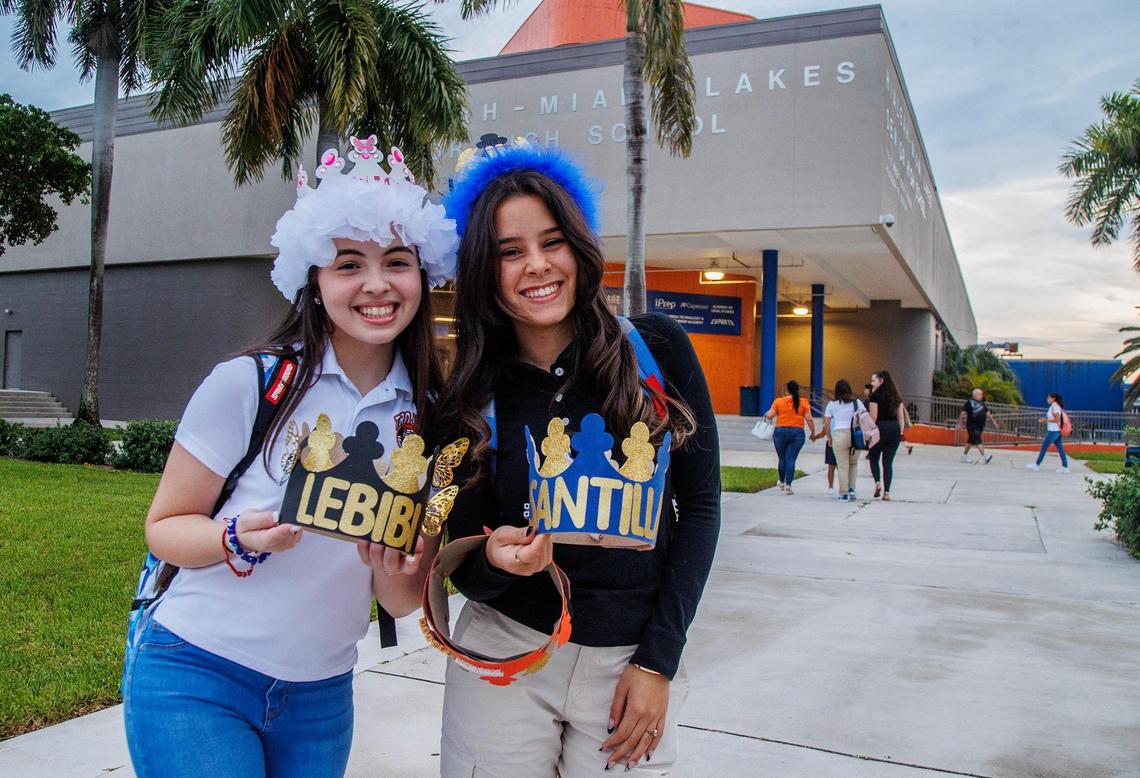 Amanda Soto, left, and Natalie Crespo wear senior crowns for the first day at Hialeah-Miami Lakes Senior High School on Thursday, Aug. 17, 2023.