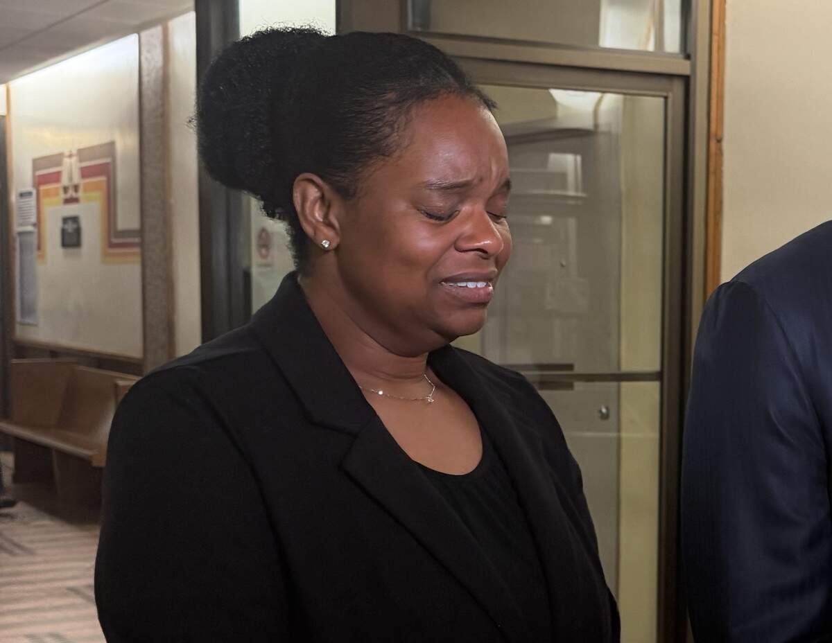 Precious Bland cries as her attorney Larry Handfield speaks to reporters outside a Miami courtroom on Tuesday, June 23, 2026.