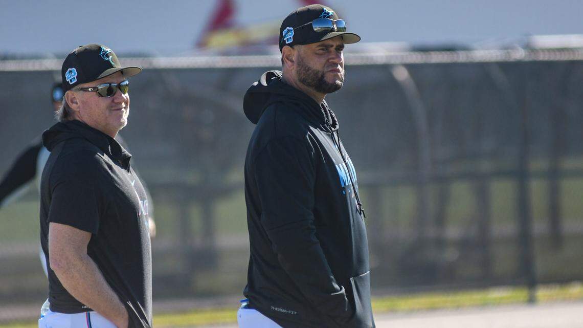 Miami Marlins pitching coach Mel Stottlemyre Jr. (left) and bullpen coach Wellington Cepeda watch on during a spring training workout on Monday, Feb. 13, 2023, at the Roger Dean Chevrolet Stadium complex in Jupiter, Florida.