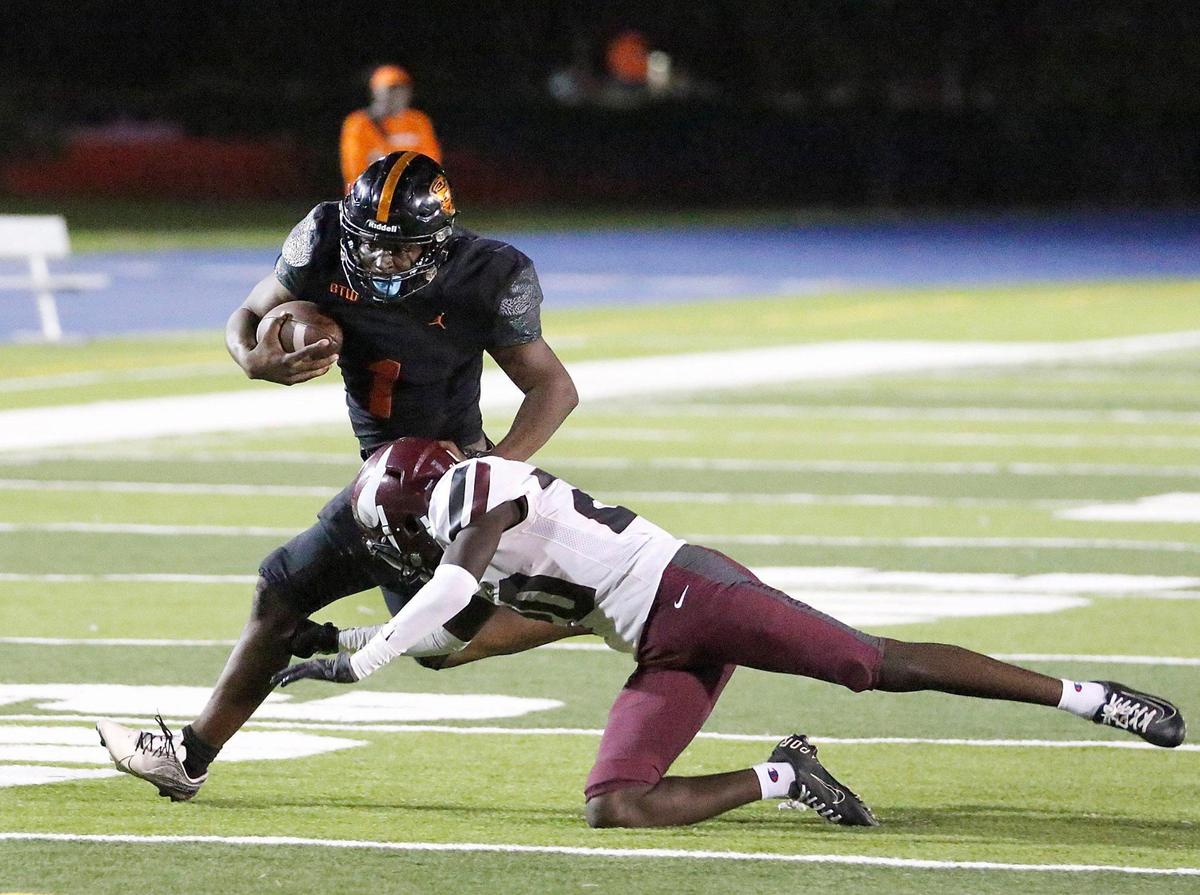 Booker T. WashingtonTornadoes running back Antwan Smith (1) attempts to evade a tackle by Norland Vikings defender during football game on Thursday, October 6, 2022 at Traz Powell Stadium in Miami. Andrew Uloza / for Miami Herald