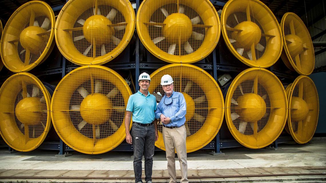 Steven W. Diaz, Ph.D., program director, left, and Richard S. Olson, director, pose in front of the Wall of Wind at the International Hurricane Research Center at Florida International University’s main campus, Dec. 14, 2021. On Monday, FIU announced that its Extreme Events Institute had landed a $12.8 million National Science Foundation grant to build a facilty that would simulate 200 mph hurricane winds.