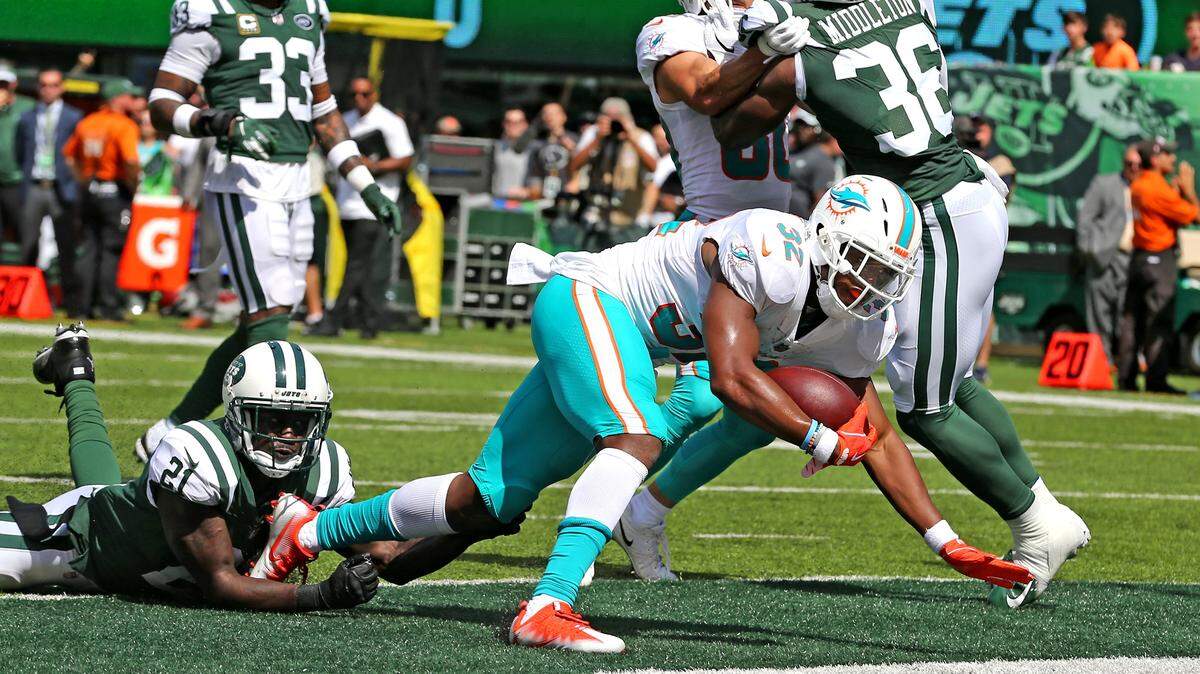 Miami Dolphins Kenyan Drake scores a first quarter touchdown as they play the New York Jets at MetLife Stadium in the Meadowlands, New Jersey, Sunday, September, 16, 2018.