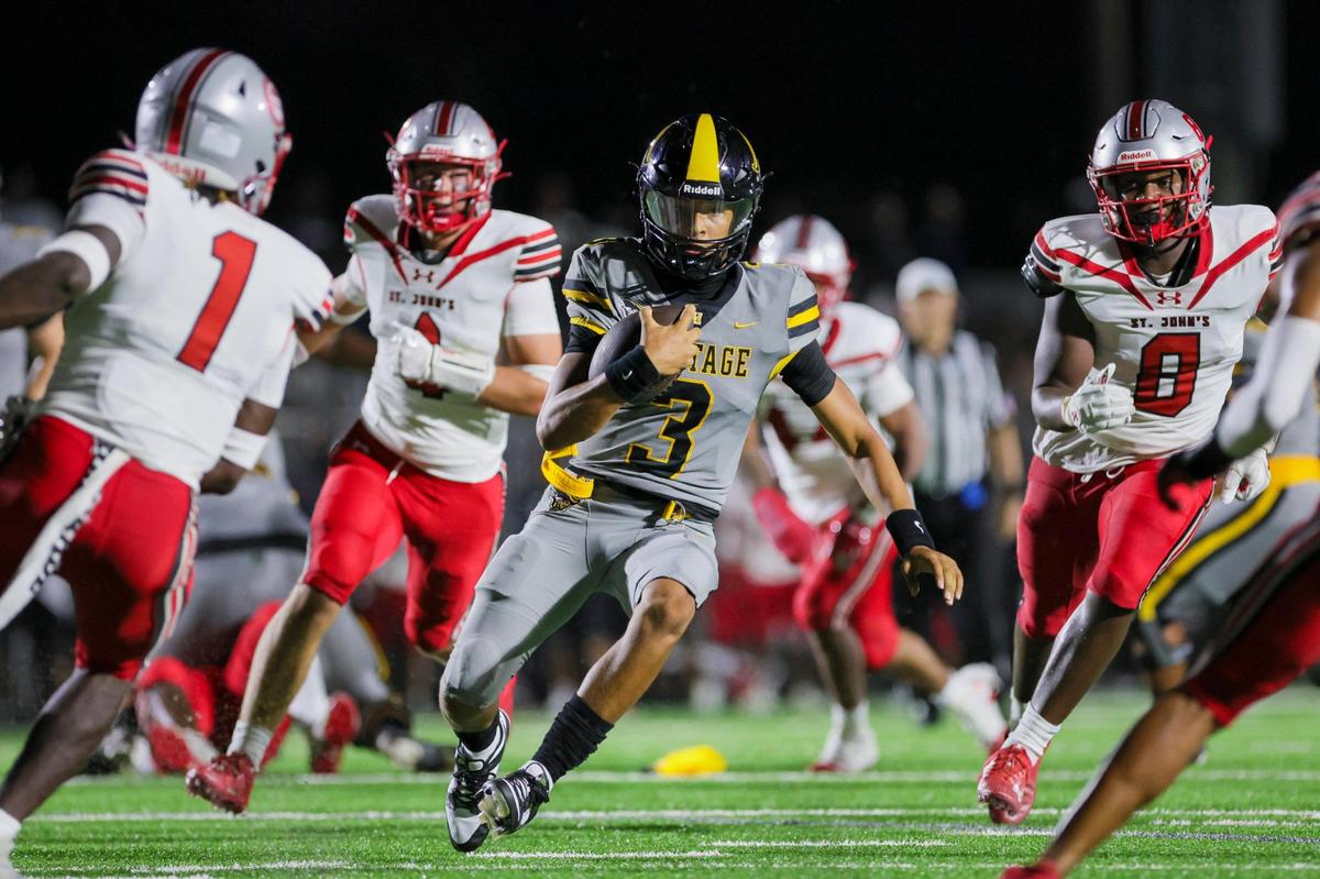 American Heritage quarterback Dia Bell (3) runs with the football against the St. John’s Cadets during the second quarter of a high school football game at American Heritage School in Plantation, Florida on Saturday, August 26, 2023.