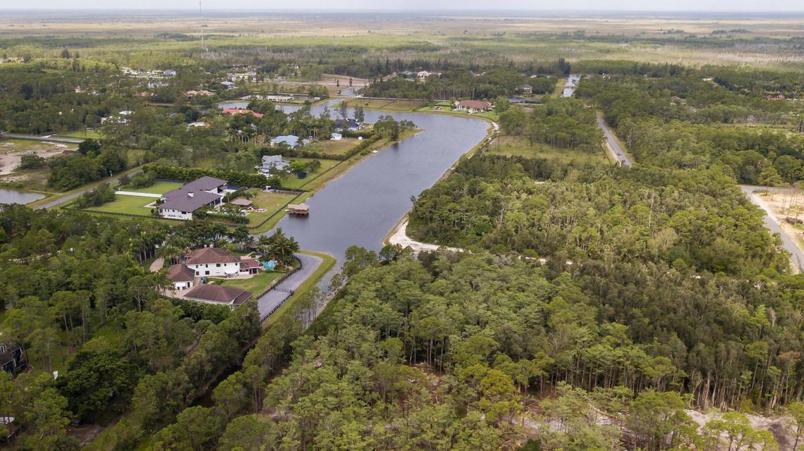 Aerial view of a home, bottom-left, and plots of land owned by Elliot Smerling in Lake Worth, Florida on Wednesday, May 19, 2021. Smerling has been accused of defrauding banks of more than $150 million.