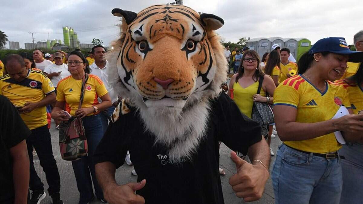 A supporter of Colombia's presidential candidate for the Defensores de la Patria movement Abelardo de la Espriella gives a thumbs up as he celebrates the results of the presidential runoff election at the Ventana al Mundo monument in Barranquilla, Colombia, on June 21, 2026. A flamboyant US-backed lawyer who has never held public office narrowly won Colombia's presidential runoff on June 21, swinging the country hard to the right on a promise to wage war against drug-running guerrilla groups. With more than 99 percent of polling centers reporting, Abelardo de la Espriella had 49.67 percent of the vote, an unassailable lead over his rival, left-wing Senator Ivan Cepeda who trailed at 48.69 percent, according to official results. (Photo by Jaime SALDARRIAGA / AFP via Getty Images)