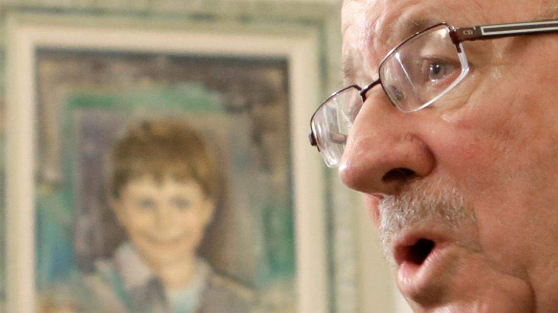 Don Ryce, father of Jimmy Ryce, talks about the scheduled execution of his son’s killer to reporters at his home in Vero Beach, Jan. 3, 2014. The painting in the background is of Jimmy Ryce, who was kidnapped, raped and murdered in 1995 in rural Miami-Dade County.