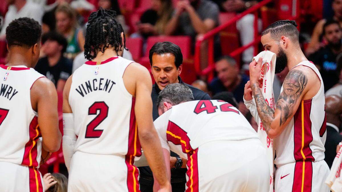 Miami Heat head coach Erik Spoelstra talks to players during a time out against the Dallas Mavericks during the third quarter at Miami-Dade Arena.