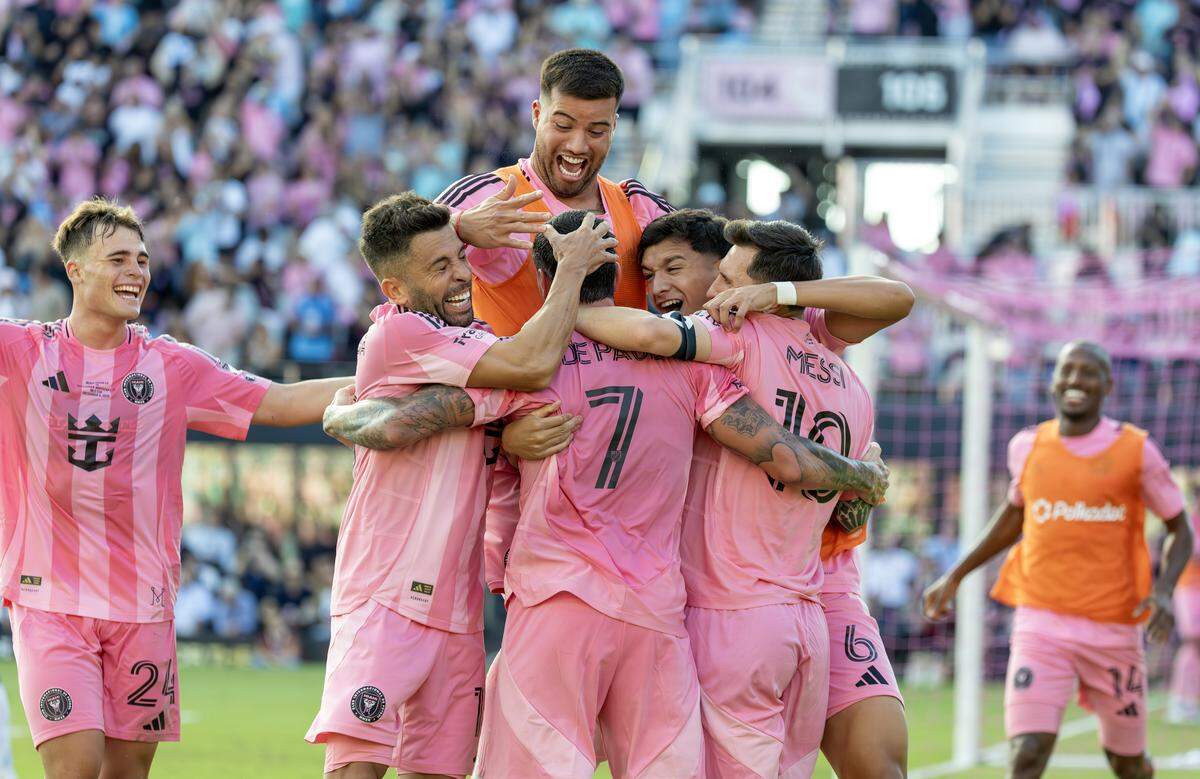 Inter Miami midfielder Rodrigo De Paul (7) celebrates with teammates after scoring the go-ahead goal during the second half of the MLS Cup final against the Vancouver Whitecaps at Chase Stadium on Saturday, Dec. 6, 2025, in Fort Lauderdale, Fla.
