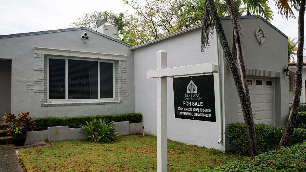 A For Sale sign sits in front of a home on May 12, 2025, in Miami.
