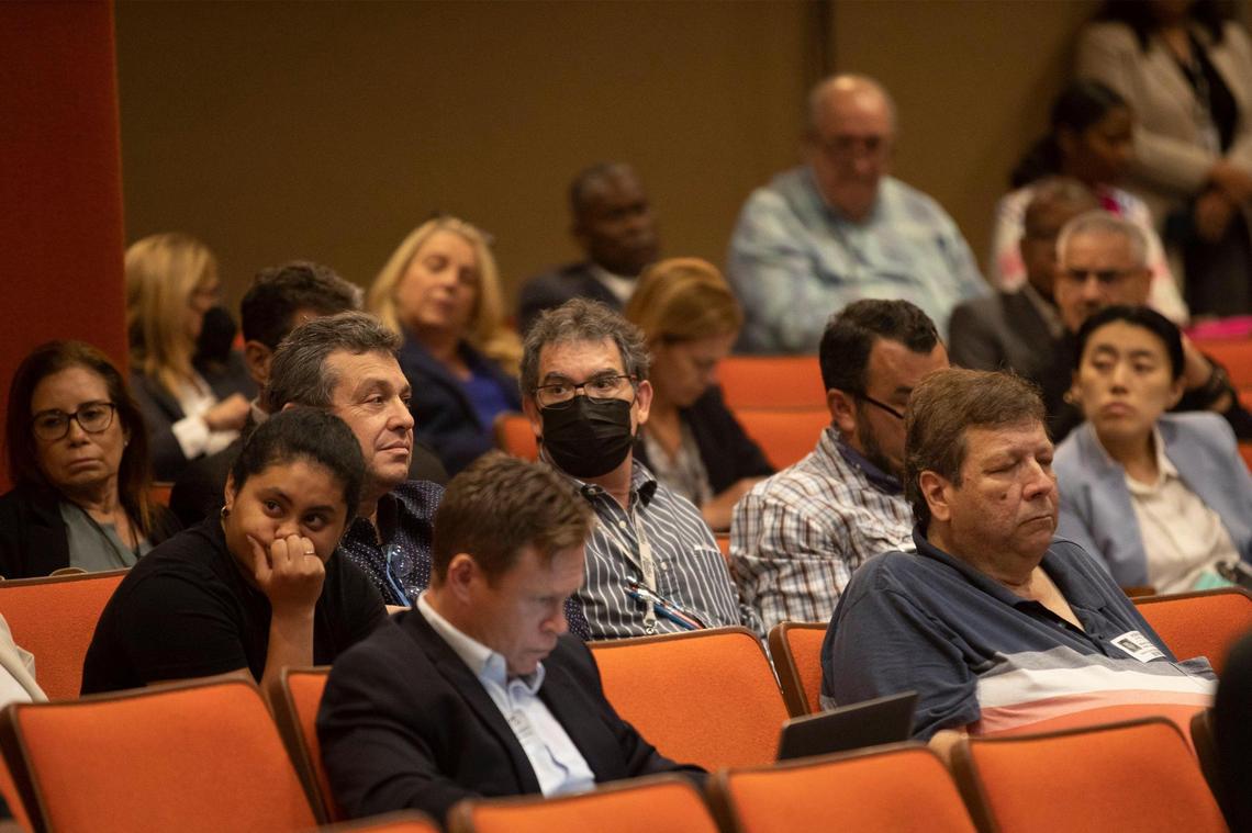 People at the Miami-Dade County School Board meeting on Wednesday, July 20, 2022, in Miami. A heated discussion ensued as some parents and community members objected to a sex education textbook, “Comprehensive Health Skills,” for middle and high school students in Miami-Dade County Public Schools. The School Board voted 5-4 not to adopt the textbook, overruling the district’s own hearing officer’s recommendation to adopt the book.