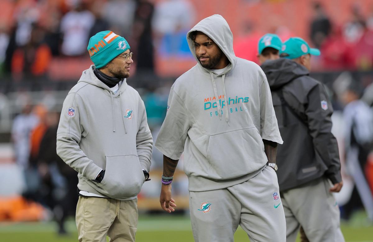 Miami Dolphins quarterback Tua Tagovailoa chats with head coach Mike McDaniel before kickoff against the Cleveland Browns on Sunday, Dec. 29, 2024, at Huntington Bank Field in Cleveland, Ohio.
