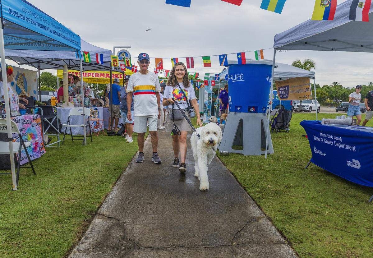 Martha and Antonio Casilimas and their Golden Doodle Ramon,  attend the World Pup at Haulover Park in Northeast Miami-Dade on Saturday, May 30, 2026. The event was inspired by the Super Bowl’s Puppy Bowl and was hosted by Miami-Dade County and Debris Free Oceans. Ramon represented Colombia.