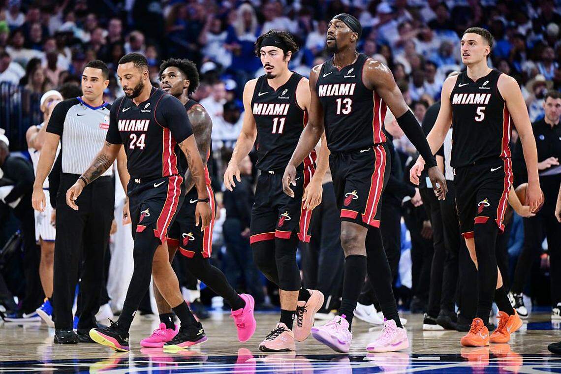ORLANDO, FLORIDA - OCTOBER 22: (L-R) Norman Powell #24, Davion Mitchell #45, Jaime Jaquez Jr. #11, Bam Adebayo #13 and Nikola Jovic #5 of the Miami Heat walk back to the bench during a time in the first half of the game against the Orlando Magic at Kia Center on October 22, 2025 in Orlando, Florida. NOTE TO USER: User expressly acknowledges and agrees that, by downloading and or using this photograph, User is consenting to the terms and conditions of the Getty Images License Agreement. (Photo by Julio Aguilar/Getty Images)