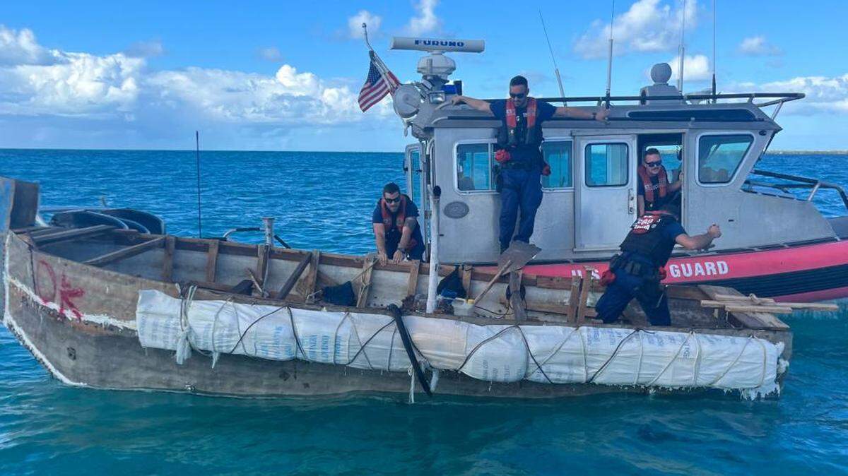 A U.S. Coast Guard patrol boat pulls next to a Cuban migrant boat off Islamorada in the Florida Keys Saturday, Nov. 5, 2022. On Monday, Nov. 7, 2022, the Coast Guard intercepted a stolen commercial fishing vessel from the Florida Keys on its way to Cuba, according to the Monroe County Sheriff’s Office.
